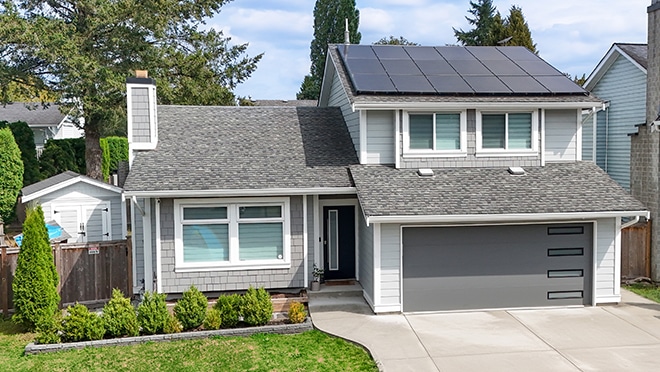 Exterior of residential house with solar panel system installati EnerGuide Evaluation Canada Greener Homes Loan